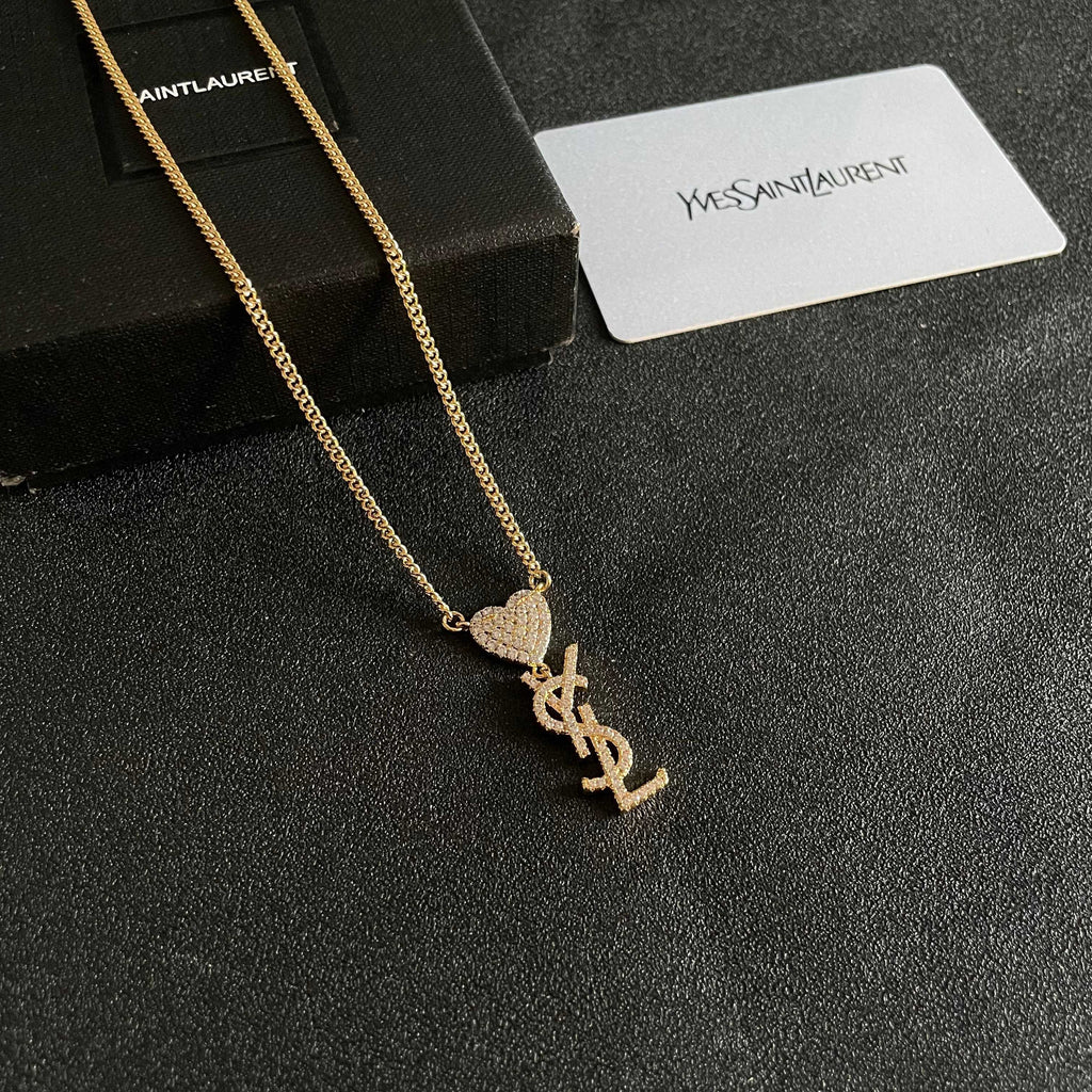 YSL 26S CRYSTAL HEART LOGO PENDANT NECKLACE IN GOLD TONE METAL 633939