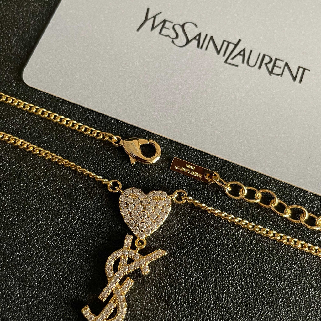 YSL 26S CRYSTAL HEART LOGO PENDANT NECKLACE IN GOLD TONE METAL 633939