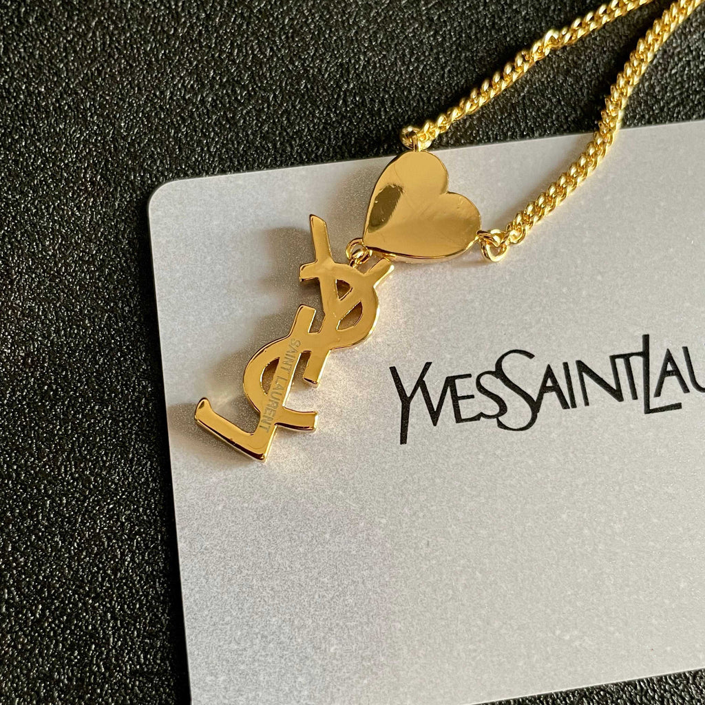 YSL 26S CRYSTAL HEART LOGO PENDANT NECKLACE IN GOLD TONE METAL 633939