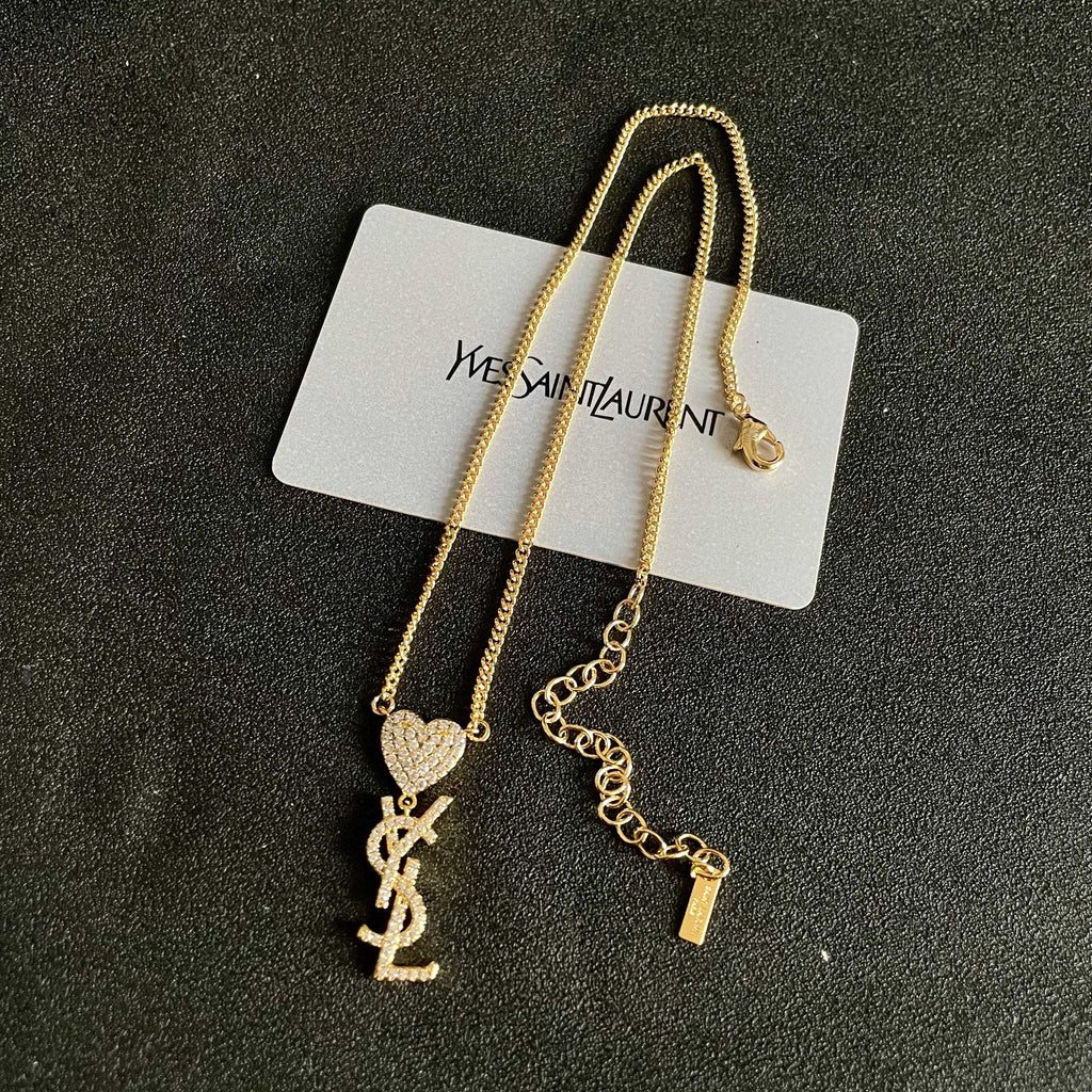 YSL 26S CRYSTAL HEART LOGO PENDANT NECKLACE IN GOLD TONE METAL 633939
