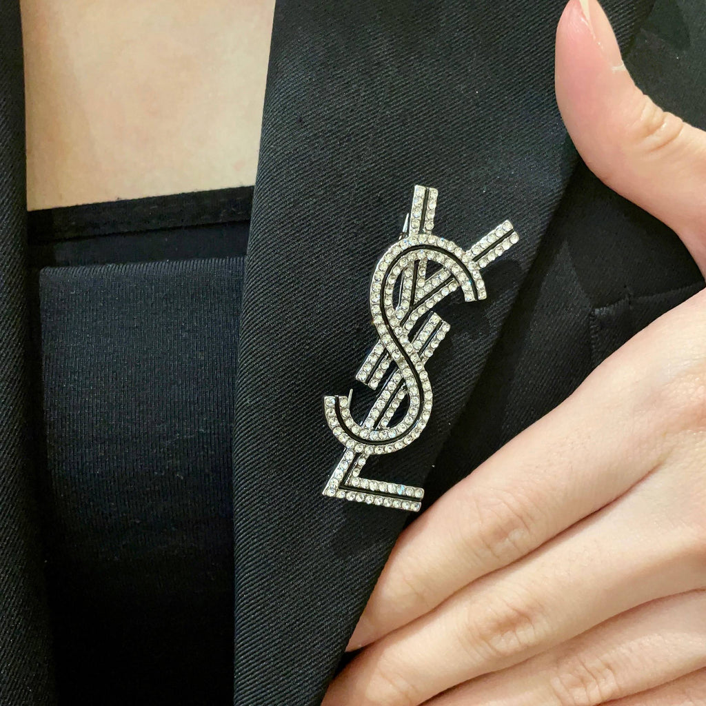 YSL 26S CRYSTAL LOGO BROOCH IN SILVER TONE METAL 634974
