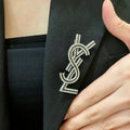 YSL 26S CRYSTAL LOGO BROOCH IN SILVER TONE METAL 634974