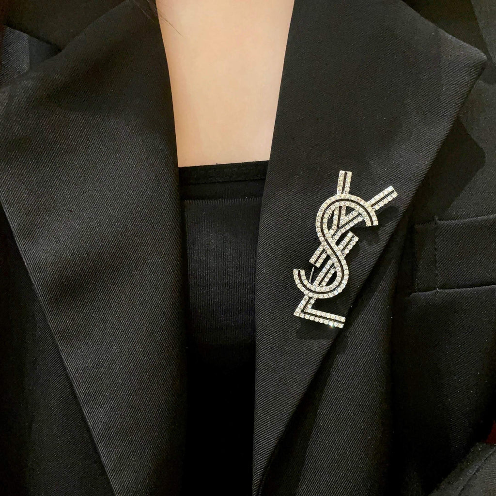 YSL 26S CRYSTAL LOGO BROOCH IN SILVER TONE METAL 634974