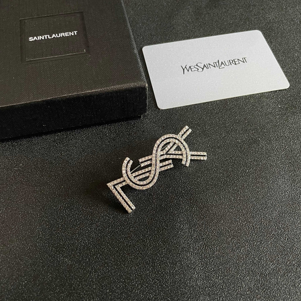 YSL 26S CRYSTAL LOGO BROOCH IN SILVER TONE METAL 634974