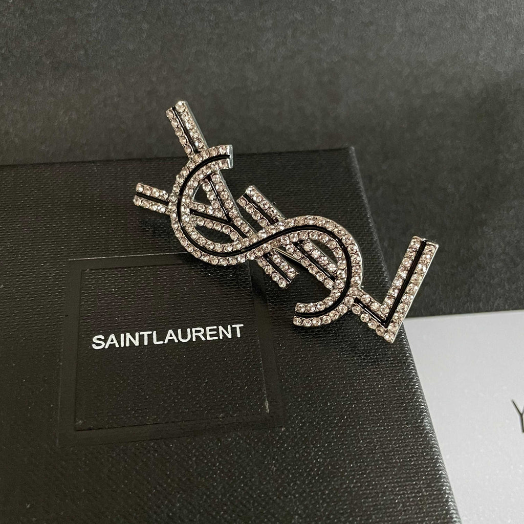 YSL 26S CRYSTAL LOGO BROOCH IN SILVER TONE METAL 634974