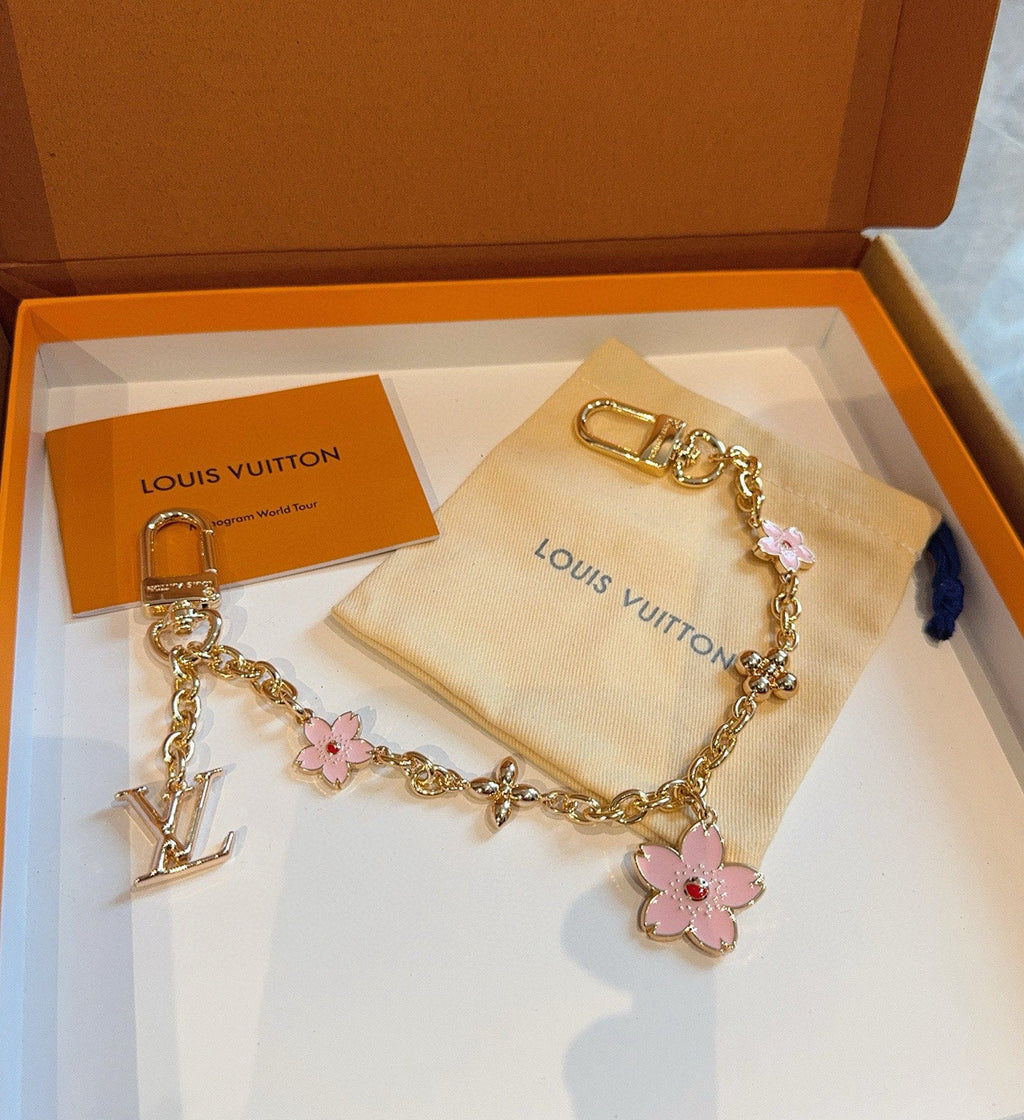 SAKURA BAG CHARM IN GOLD METAL HARDWARE