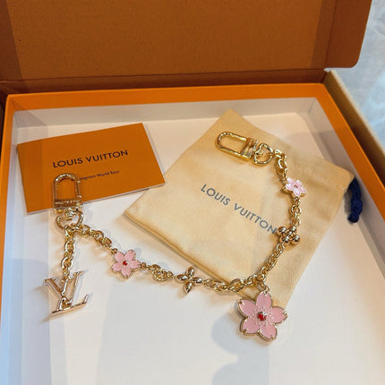 SAKURA BAG CHARM IN GOLD METAL HARDWARE