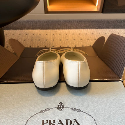 PRADA 26S POINTED TOE BOW FLATS IN IVORY WHITE CALFSKIN