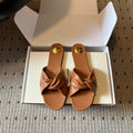 YSL 26S TWISTED-STRAP FLAT SANDALS IN  BROWN LAMBSKIN