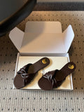 YSL 26S TWISTED-STRAP FLAT SANDALS IN DARK BROWN LAMBSKIN