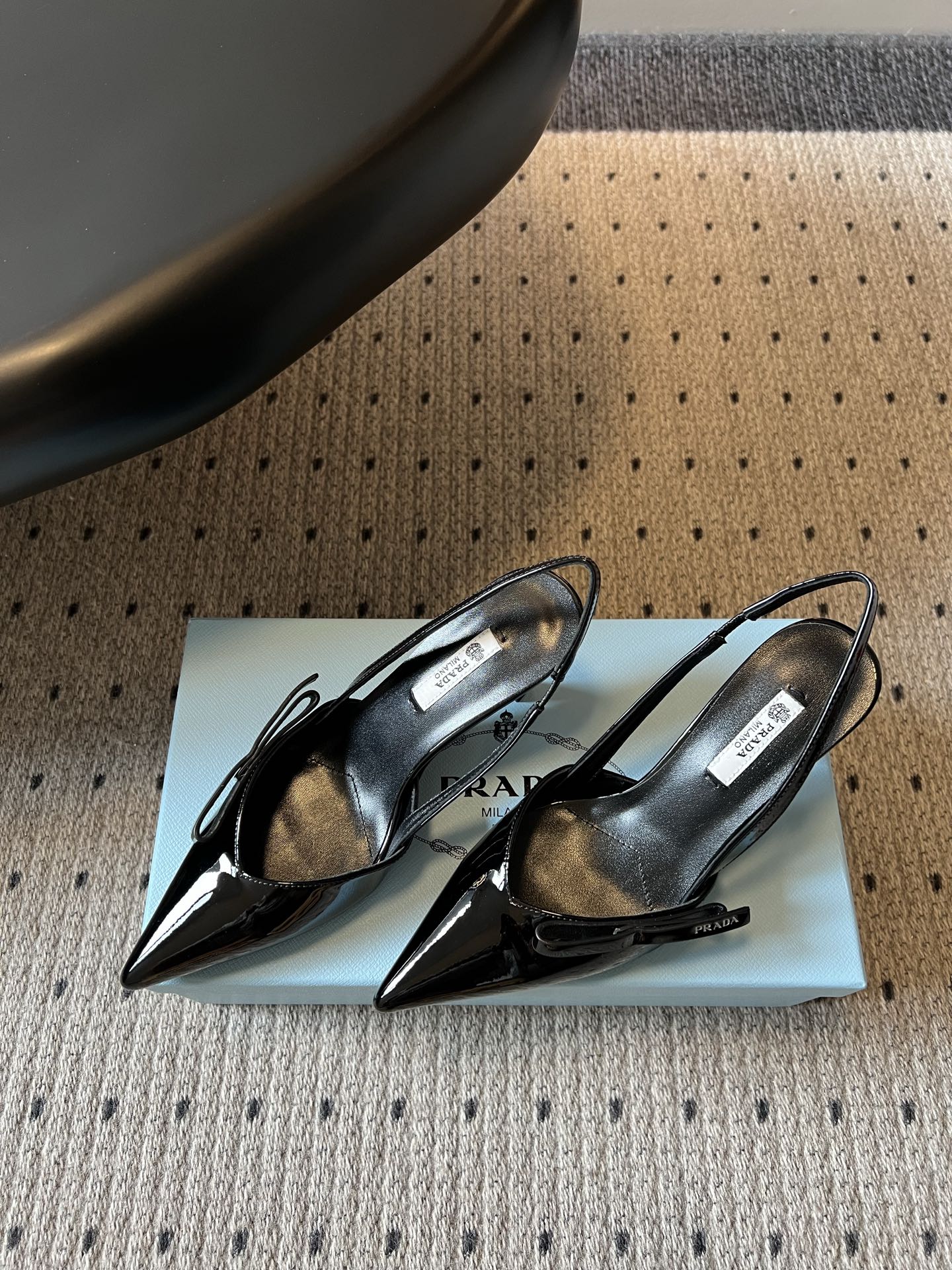 PRADA 26S BOW DETAIL SLINGBACK PUMPS 75MM IN BLACK PATENT CALFSKIN