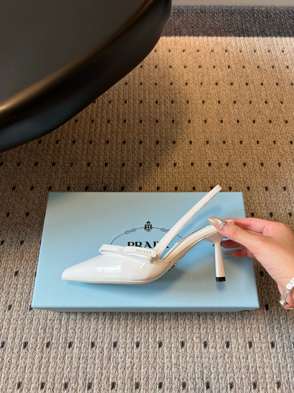 PRADA 26S BOW DETAIL SLINGBACK PUMPS 75MM IN WHITE PATENT CALFSKIN
