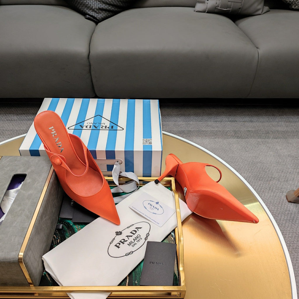 PRADA 26S HIGH-HEELED MULES 85MM IN ORANGE SATIN