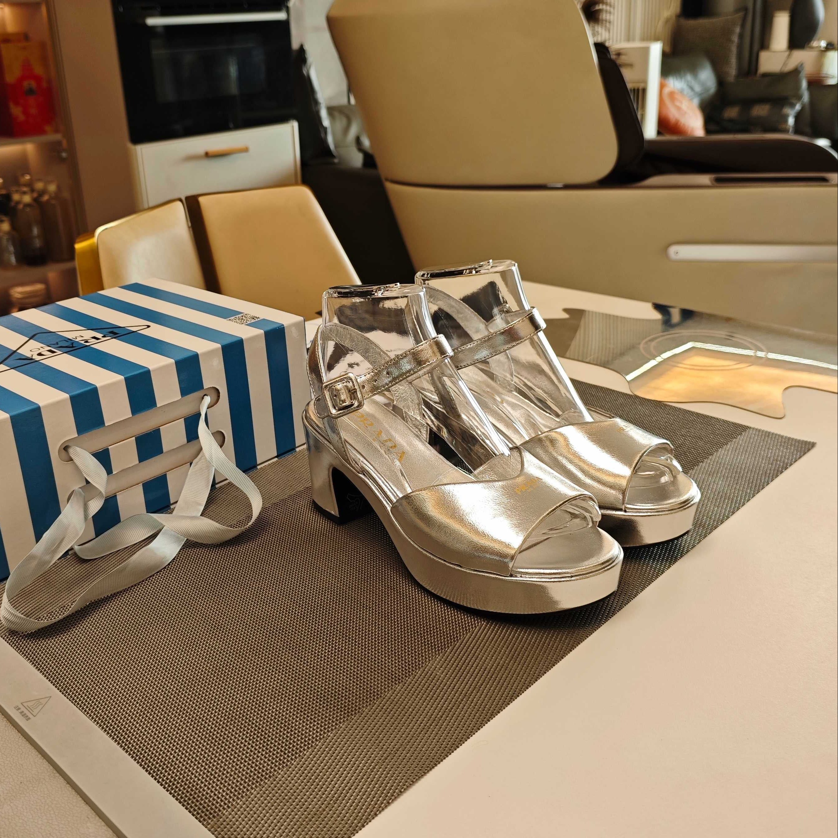 PRADA 26S HEELED SANDALS 65MM IN SILVER CALFSKIN