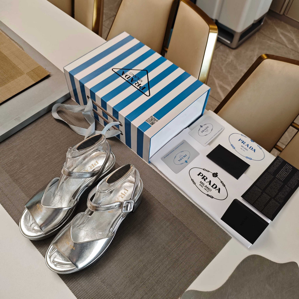 PRADA 26S HEELED SANDALS 65MM IN SILVER CALFSKIN