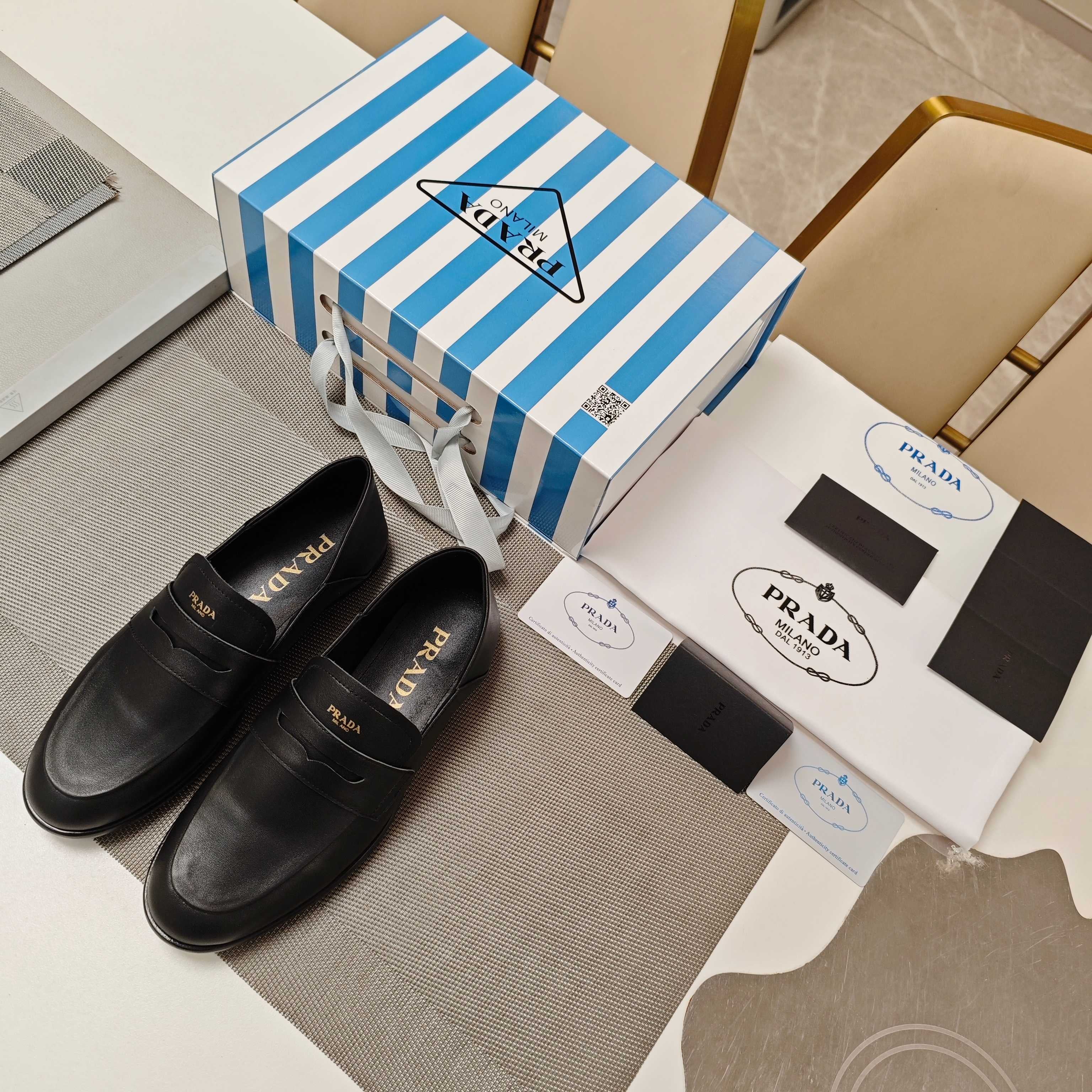 PRADA 26S LOAFERS 20MM IN BLACK CALFSKIN