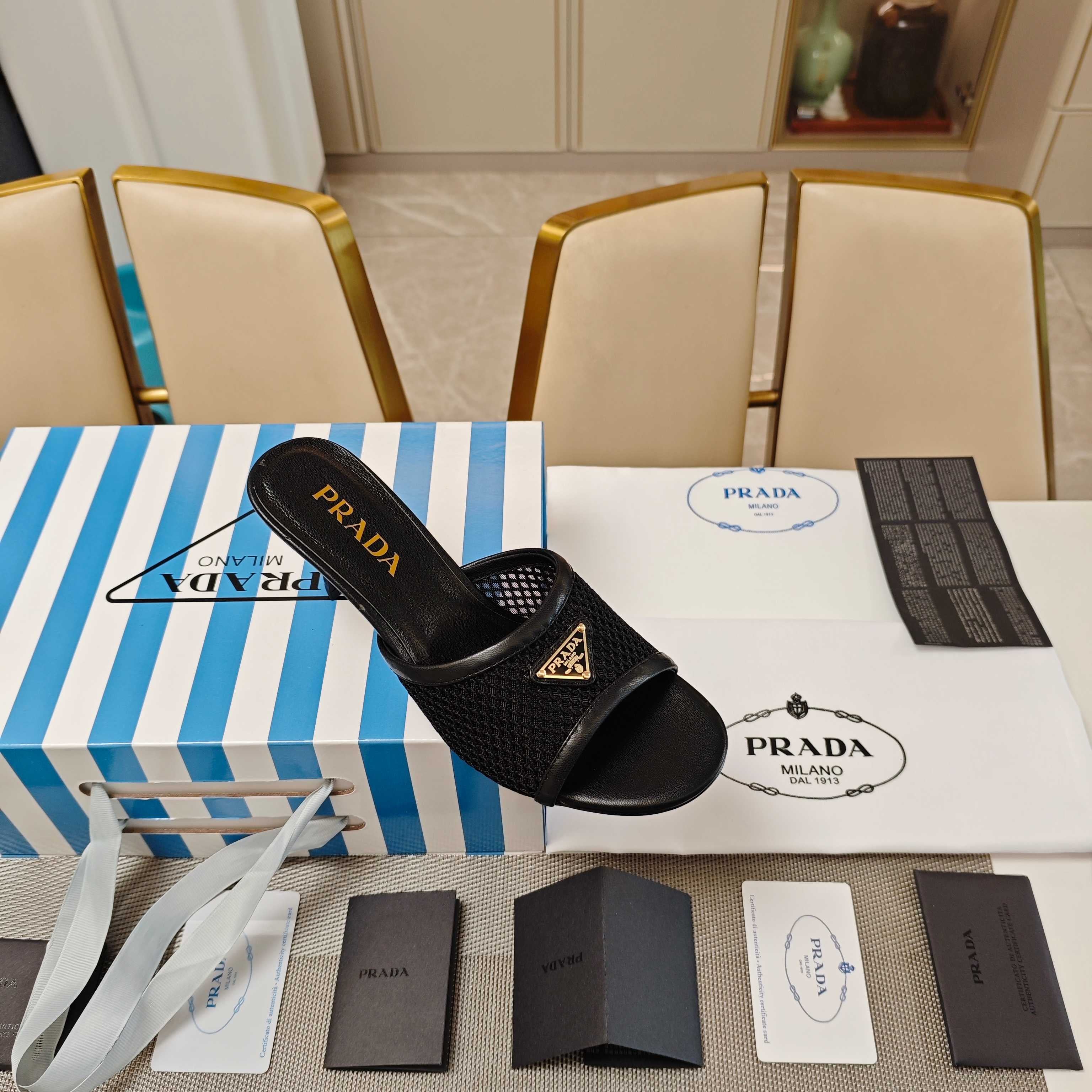 PRADA 26S MULE SANDALS 75MM IN BLACK CALFSKIN AND MESH GOLD HARDWARE