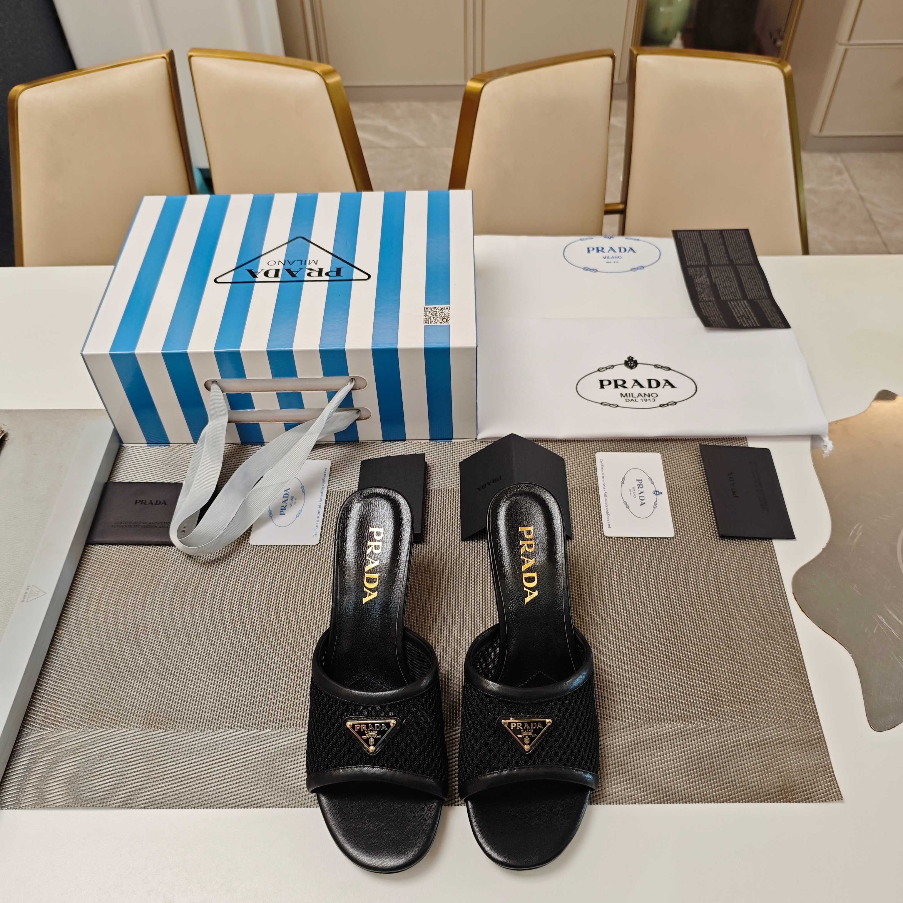 PRADA 26S MULE SANDALS 75MM IN BLACK CALFSKIN AND MESH GOLD HARDWARE