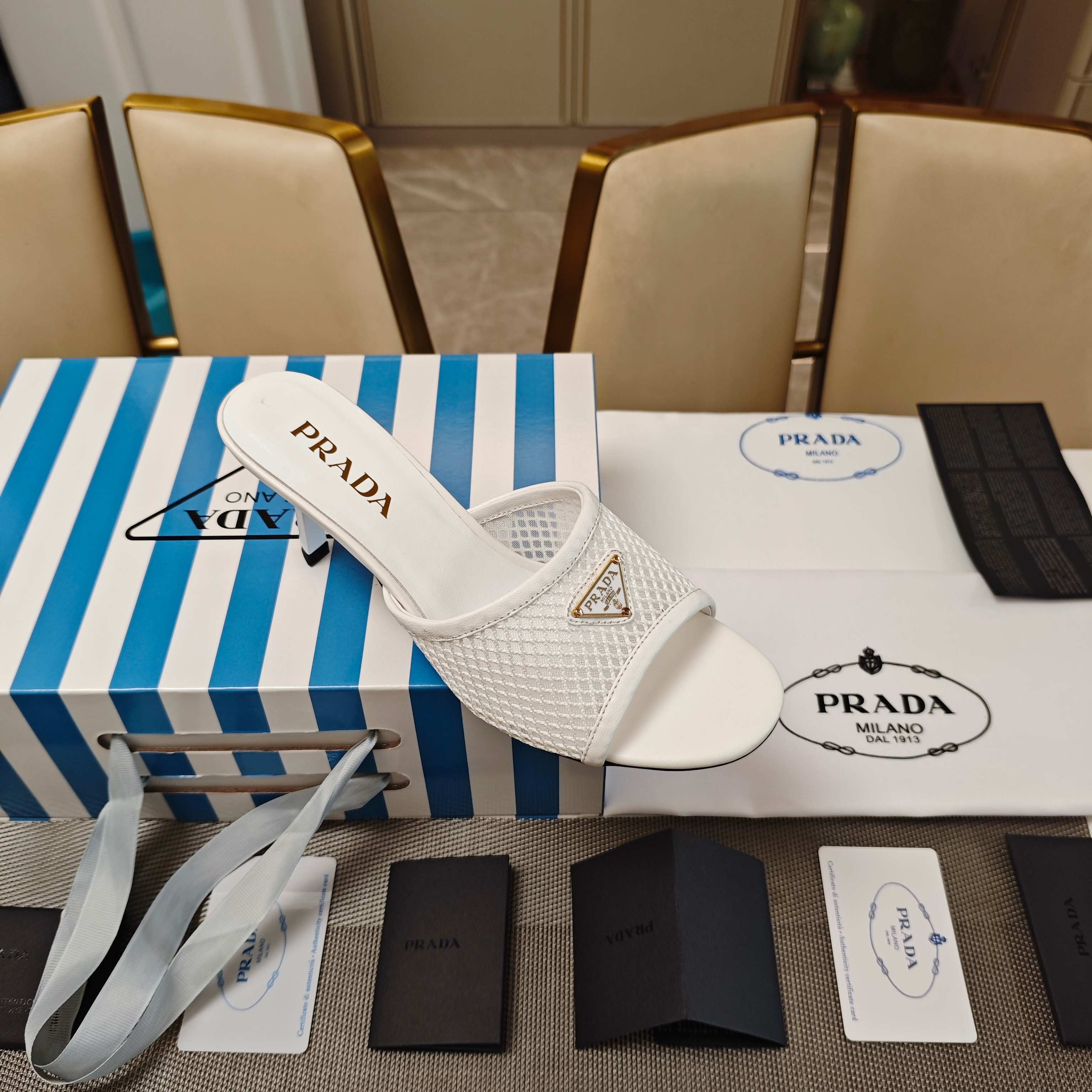 PRADA 26S MULE SANDALS 75MM IN WHITE CALFSKIN AND MESH GOLD HARDWARE