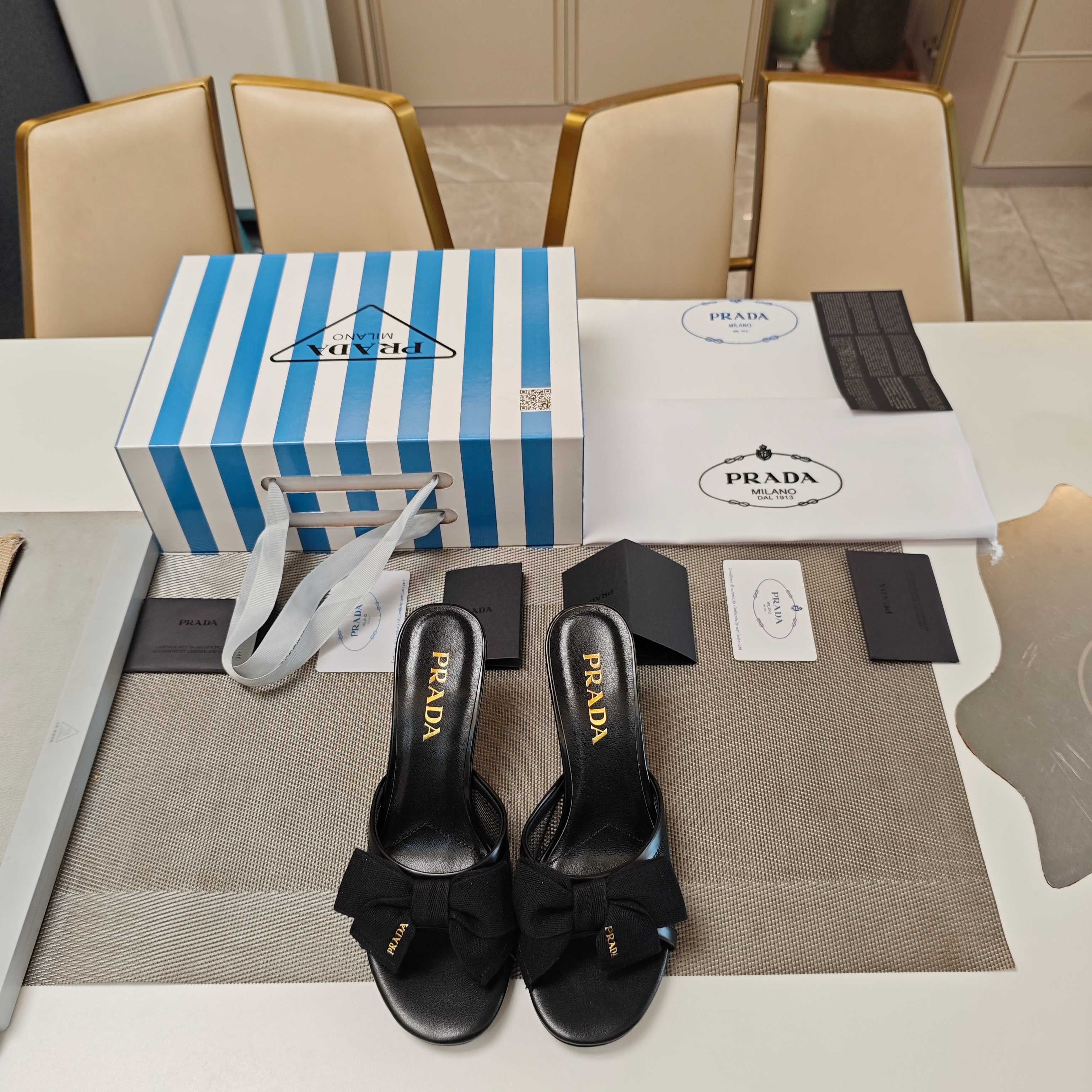 PRADA 26S HEEL MULE SANDALS 75MM IN BLACK CALFSKIN WITH BOW