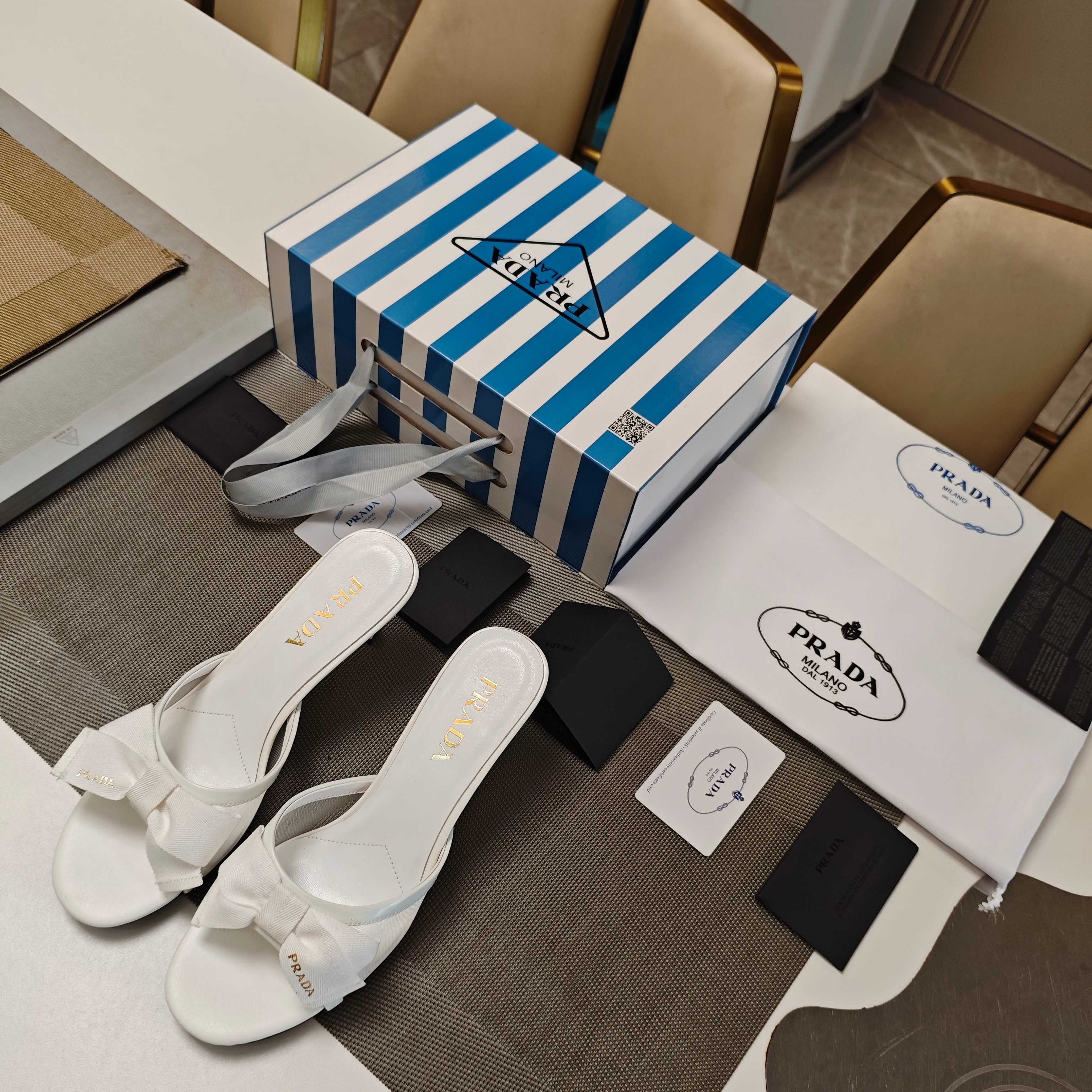 PRADA 26S HEEL MULE SANDALS 75MM IN WHITE CALFSKIN WITH BOW