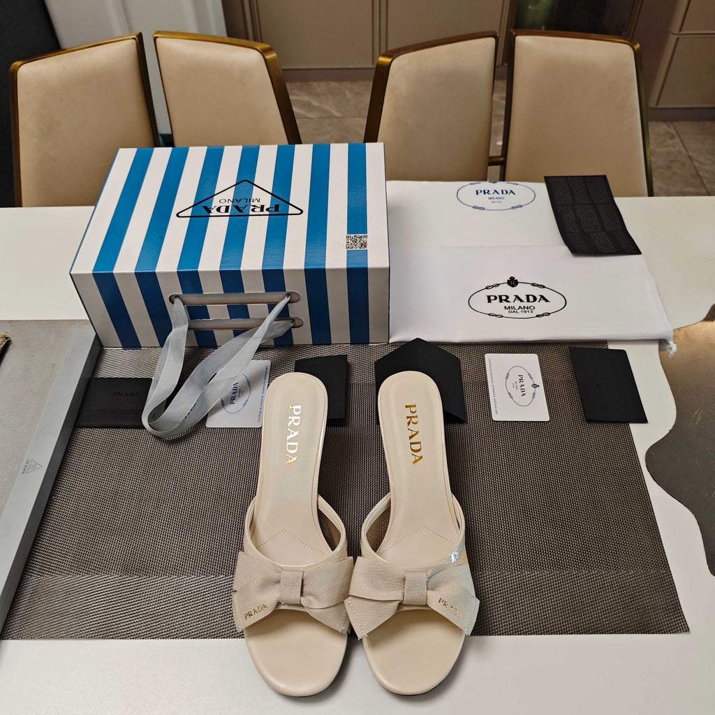 PRADA 26S HEEL MULE SANDALS 75MM IN IVORY WHITE CALFSKIN WITH BOW