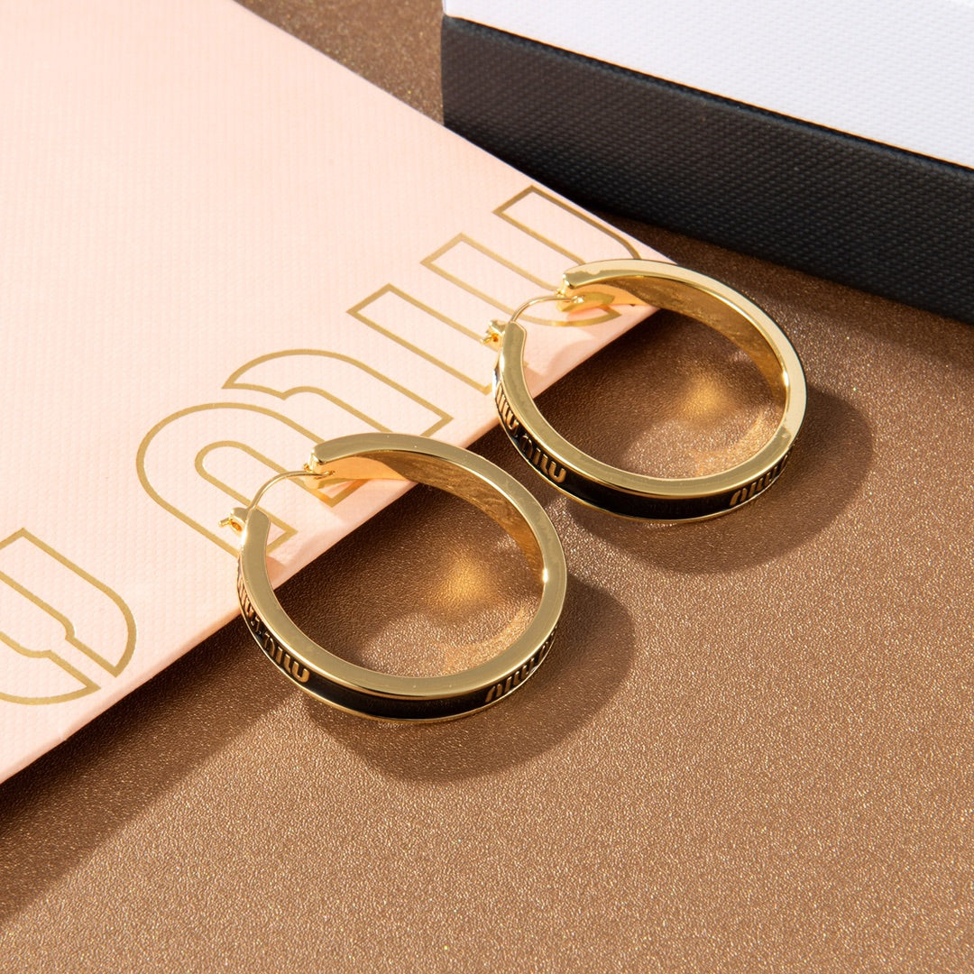 MIUMIU 26S LOGO HOOP EARRINGS IN BLACK ENAMEL AND GOLD TONE METAL 626893