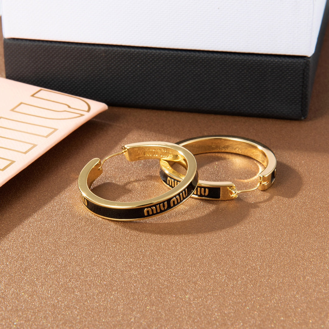 MIUMIU 26S LOGO HOOP EARRINGS IN BLACK ENAMEL AND GOLD TONE METAL 626893