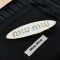 MIUMIU 26S CRYSTAL LOGO HAIR CLIP IN WHITE ENAMEL AND GOLD TONE METAL 626894