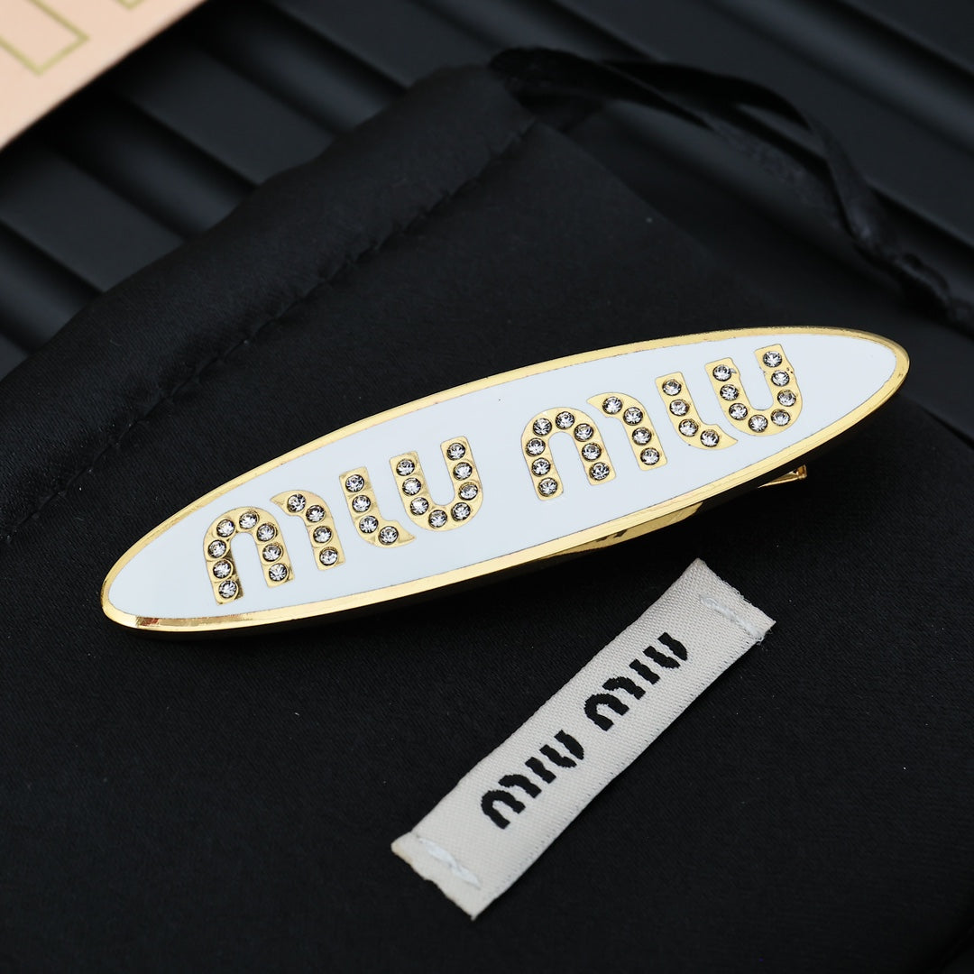 MIUMIU 26S CRYSTAL LOGO HAIR CLIP IN WHITE ENAMEL AND GOLD TONE METAL 626894