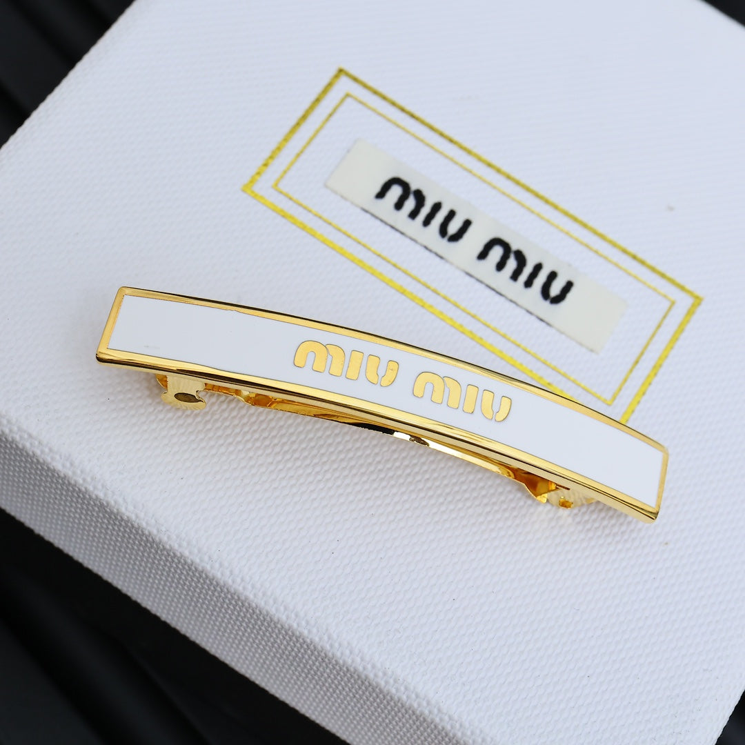 MIUMIU 26S LOGO BAR HAIR CLIP IN WHITE ENAMEL AND GOLD TONE METAL 612610
