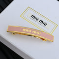 MIUMIU 26S LOGO BAR HAIR CLIP IN PINK ENAMEL AND GOLD TONE METAL 612610