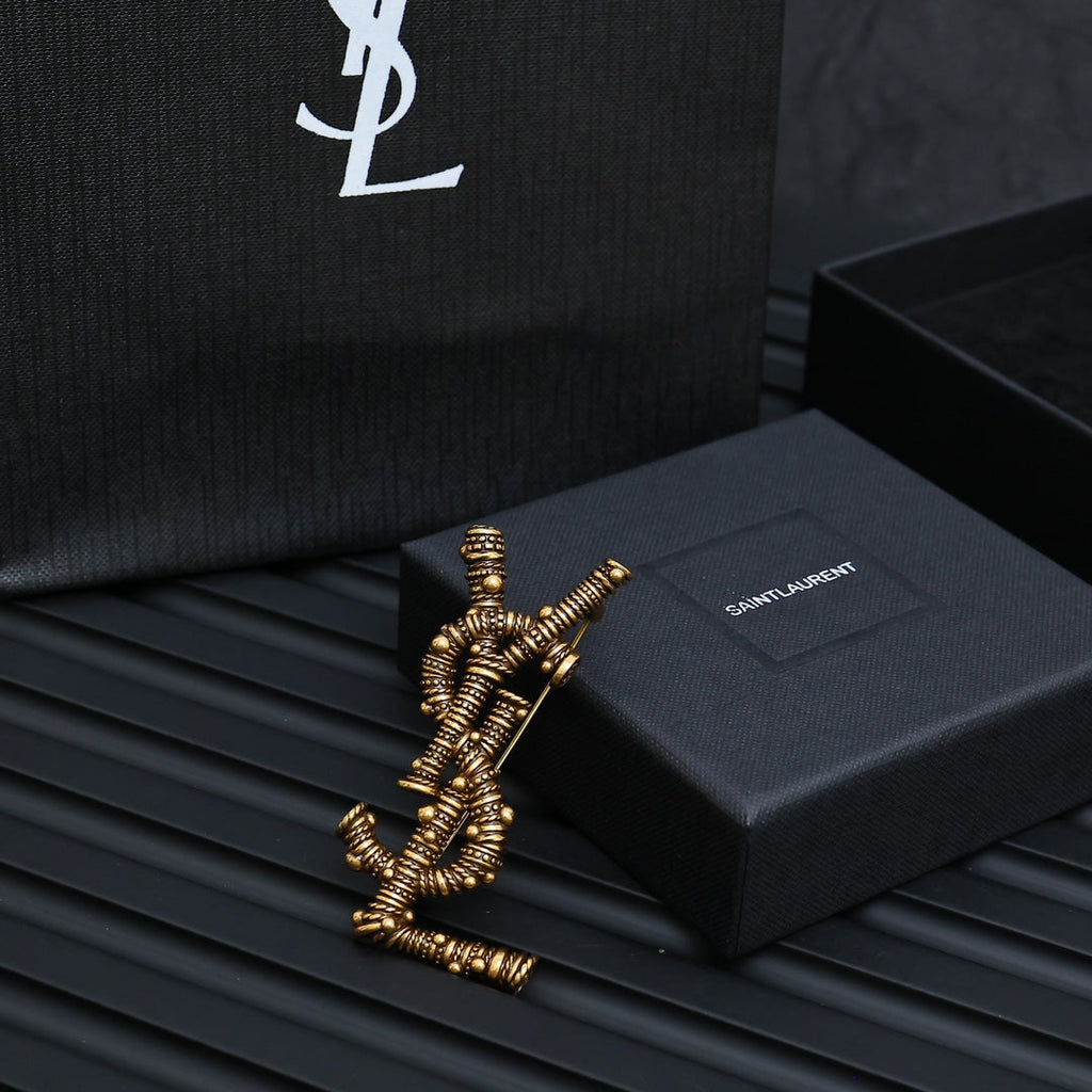 YSL 26S ORNATE TEXTURED MONOGRAM BROOCH IN ANTIQUE GOLD TONE METAL 617587
