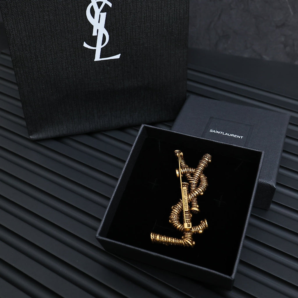 YSL 26S ORNATE TEXTURED MONOGRAM BROOCH IN ANTIQUE GOLD TONE METAL 617587