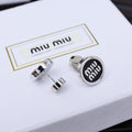 MIUMIU 26S ROUND LOGO STUD EARRINGS IN BLACK ENAMEL AND SILVER TONE METAL 625609