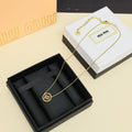 MIUMIU 26S ROUND LOGO PENDANT NECKLACE IN BROWN ENAMEL AND GOLD TONE METAL 612608
