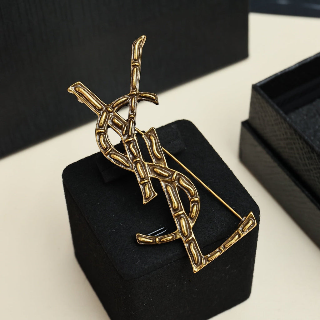 YSL 26S BAMBOO TEXTURED MONOGRAM BROOCH IN GOLD TONE METAL
