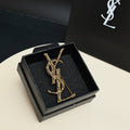 YSL 26S BAMBOO TEXTURED MONOGRAM BROOCH IN GOLD TONE METAL