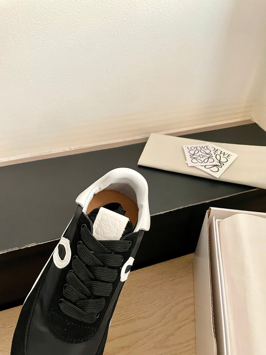 LOEWE 26S FLOW RUNNER SNEAKER IN BLACK SUEDE AND WHITE SHEEPSKIN