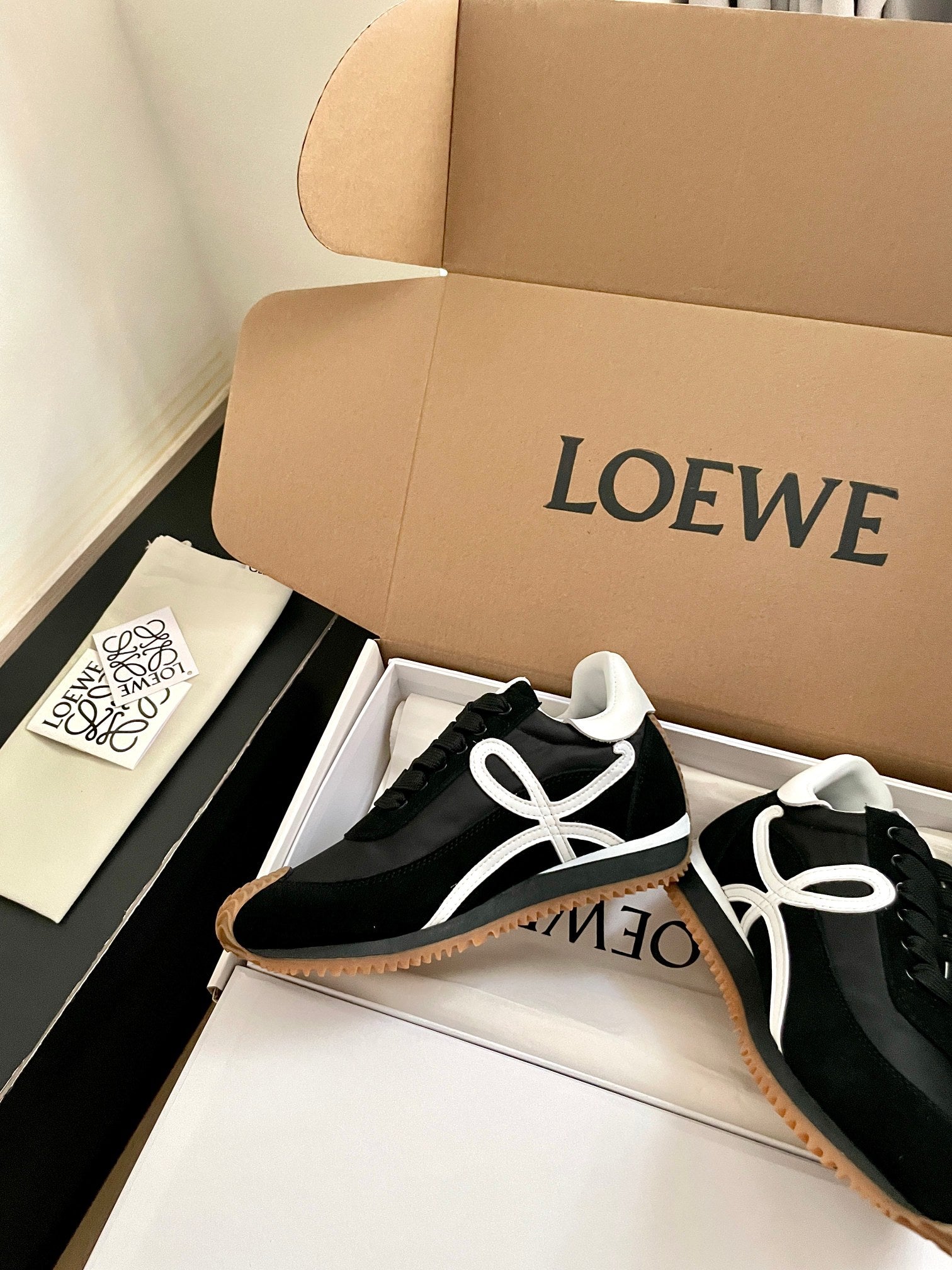 LOEWE 26S FLOW RUNNER SNEAKER IN BLACK SUEDE AND WHITE SHEEPSKIN