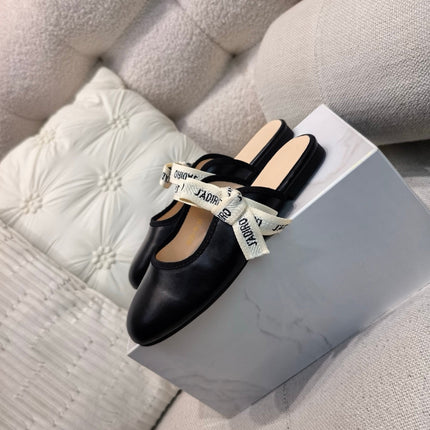DIOR 26S FLAT MULES IN BLACK CALFSKIN WITH J'ADIOR BOW