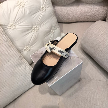 DIOR 26S FLAT MULES IN BLACK CALFSKIN WITH J'ADIOR BOW