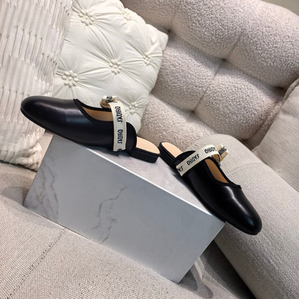 DIOR 26S FLAT MULES IN BLACK CALFSKIN WITH J'ADIOR BOW