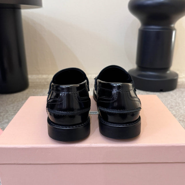 MIUMIU 26S FRINGE PENNY LOAFERS IN BLACK CALFSKIN