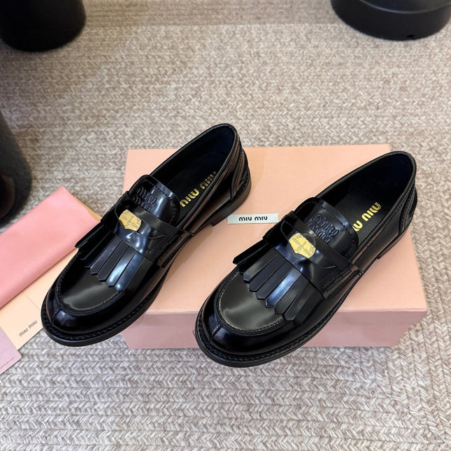 MIUMIU 26S FRINGE PENNY LOAFERS IN BLACK CALFSKIN