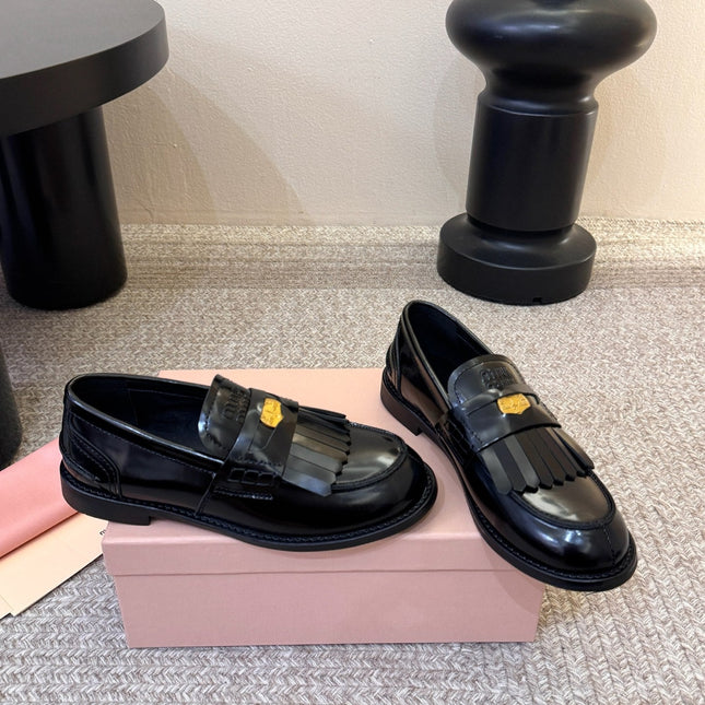 MIUMIU 26S FRINGE PENNY LOAFERS IN BLACK CALFSKIN