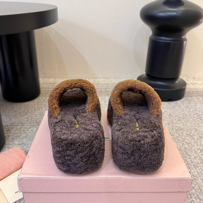 MIUMIU 26S PLATFORM SLIDES IN DARK BROWN SHEARLING