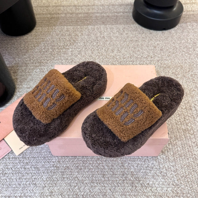 MIUMIU 26S PLATFORM SLIDES IN DARK BROWN SHEARLING