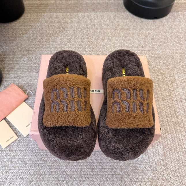 MIUMIU 26S PLATFORM SLIDES IN DARK BROWN SHEARLING