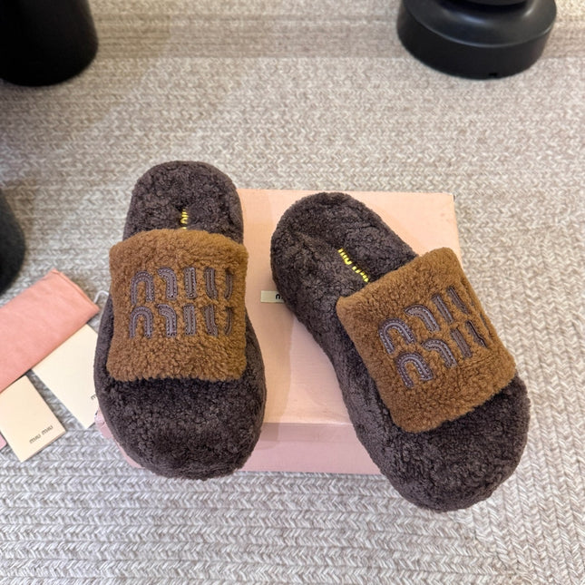 MIUMIU 26S PLATFORM SLIDES IN DARK BROWN SHEARLING